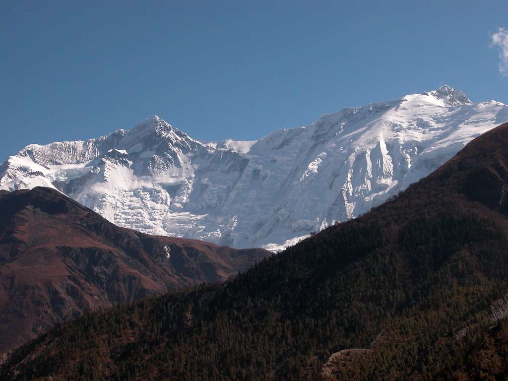 Annapurna 12 09 Annapurna II and Annapurna IV From Braga From Braga, the north face of Annapurna II (7937m) leads across a long ridge to Annapurna IV (7525m). Annapurna IV was first climbed on May 30, 1955 via the North Face and Northwest Ridge by Heinz Steinmetz, Harald Biller, and Jrgen Wellenkamp.